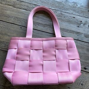 Harvey’s pink small seatbelt purse